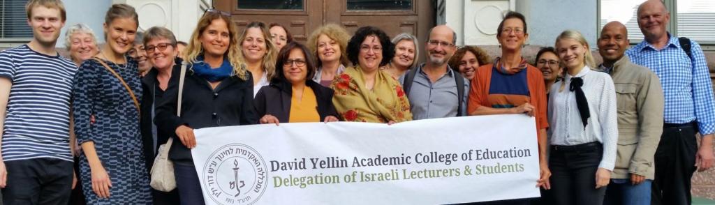 college_staff_holding_a_banner