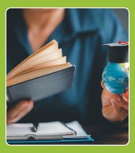 lady holding a book and a globe